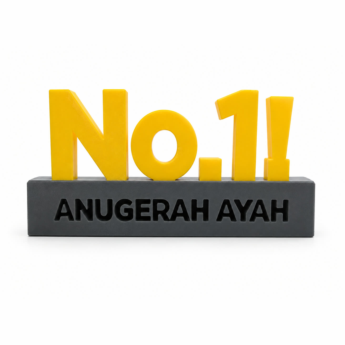 A 3D printed award: a yellow No.1 with an exclamation mark standing on a dark grey block engraved with the words ANUGERAH AYAH.